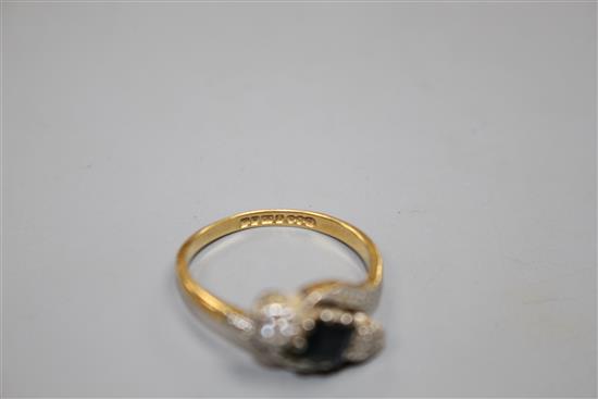 A modern 18ct gold, sapphire and illusion set diamond three stone crossover ring, size L, gross weight 3.5 grams.